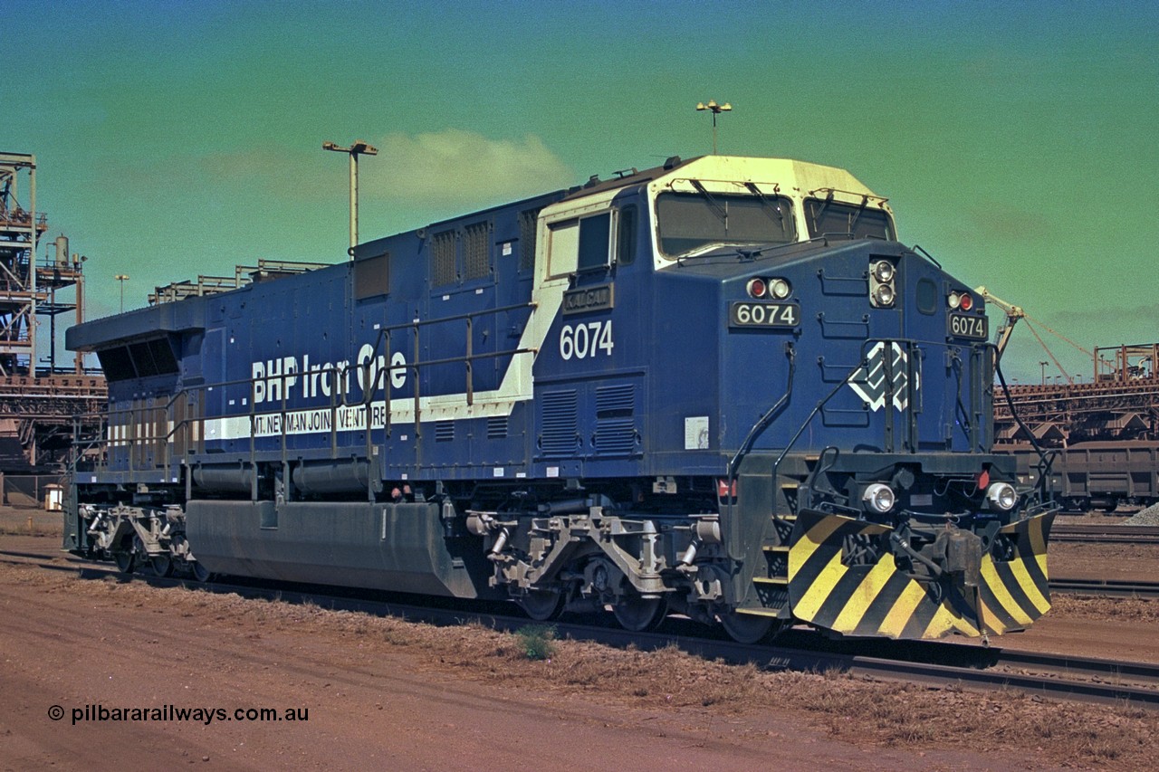 252-20
Nelson Point BHP Iron Ore's General Electric built AC6000 unit 6074 'Kalgan' serial number 51066 is shutdown near the wheel lathe. Early December 2001.
Keywords: 6074;GE;AC6000;51066;