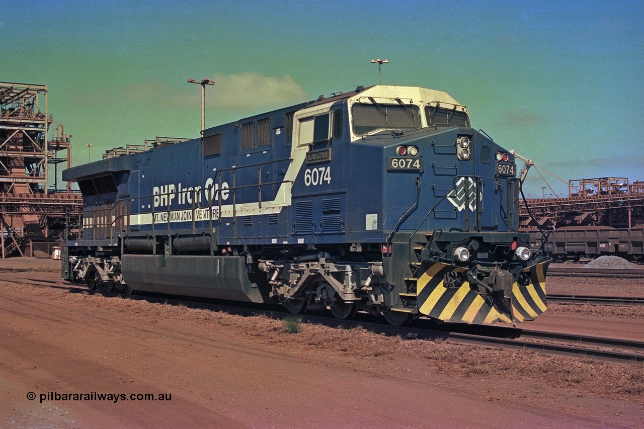 252-21
Nelson Point BHP Iron Ore's General Electric built AC6000 unit 6074 'Kalgan' serial number 51066 is shutdown near the wheel lathe. Early December 2001.
Keywords: 6074;GE;AC6000;51066;