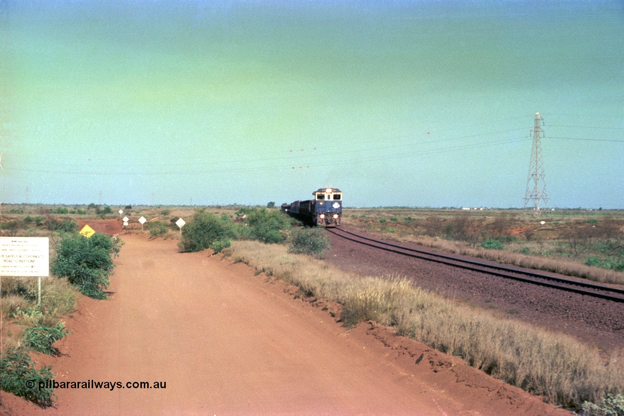 252-30
Port Hedland at 12 Mile Creek a loaded Yarrie train crosses over the creek behind Goninan CM40-8M GE rebuild unit 5645 'Sherlock' serial number 8281-11 / 92-134. Early December 2001.
Keywords: 5645;Goninan;GE;CM40-8M;8281-11/92-134;rebuild;AE-Goodwin;ALCo;M636C;5475;G6047-7;