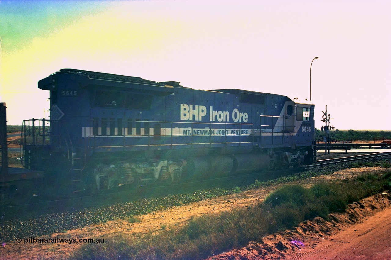 252-34
Port Hedland at 12 Mile Creek a loaded Yarrie train about the cross the Broome Rd at the 19.4 km behind Goninan CM40-8M GE rebuild unit 5645 'Sherlock' serial number 8281-11 / 92-134. Early December 2001.
Keywords: 5645;Goninan;GE;CM40-8M;8281-11/92-134;rebuild;AE-Goodwin;ALCo;M636C;5475;G6047-7;