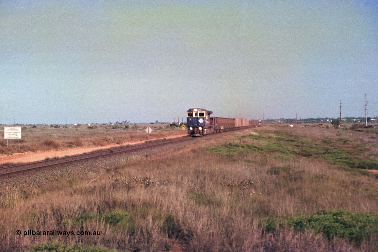 252-35
Boodarie, a loaded Yarrie train is crossing the Roebourne Rd at the 9.6 km behind Goninan CM40-8M GE rebuild unit 5645 'Sherlock' serial number 8281-11 / 92-134. Early December 2001.
Keywords: 5645;Goninan;GE;CM40-8M;8281-11/92-134;rebuild;AE-Goodwin;ALCo;M636C;5475;G6047-7;