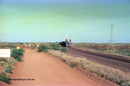 252-30
Port Hedland at 12 Mile Creek a loaded Yarrie train crosses over the creek behind Goninan CM40-8M GE rebuild unit 5645 'Sherlock' serial number 8281-11 / 92-134. Early December 2001.
Keywords: 5645;Goninan;GE;CM40-8M;8281-11/92-134;rebuild;AE-Goodwin;ALCo;M636C;5475;G6047-7;