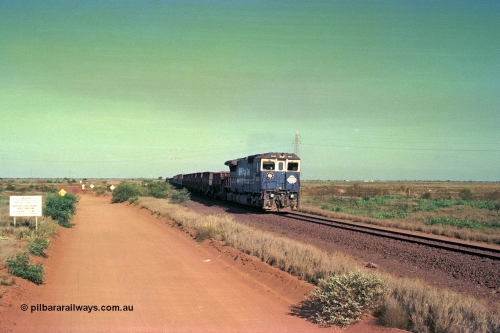 252-32
Port Hedland at 12 Mile Creek a loaded Yarrie train crosses over the creek behind Goninan CM40-8M GE rebuild unit 5645 'Sherlock' serial number 8281-11 / 92-134. Early December 2001.
Keywords: 5645;Goninan;GE;CM40-8M;8281-11/92-134;rebuild;AE-Goodwin;ALCo;M636C;5475;G6047-7;
