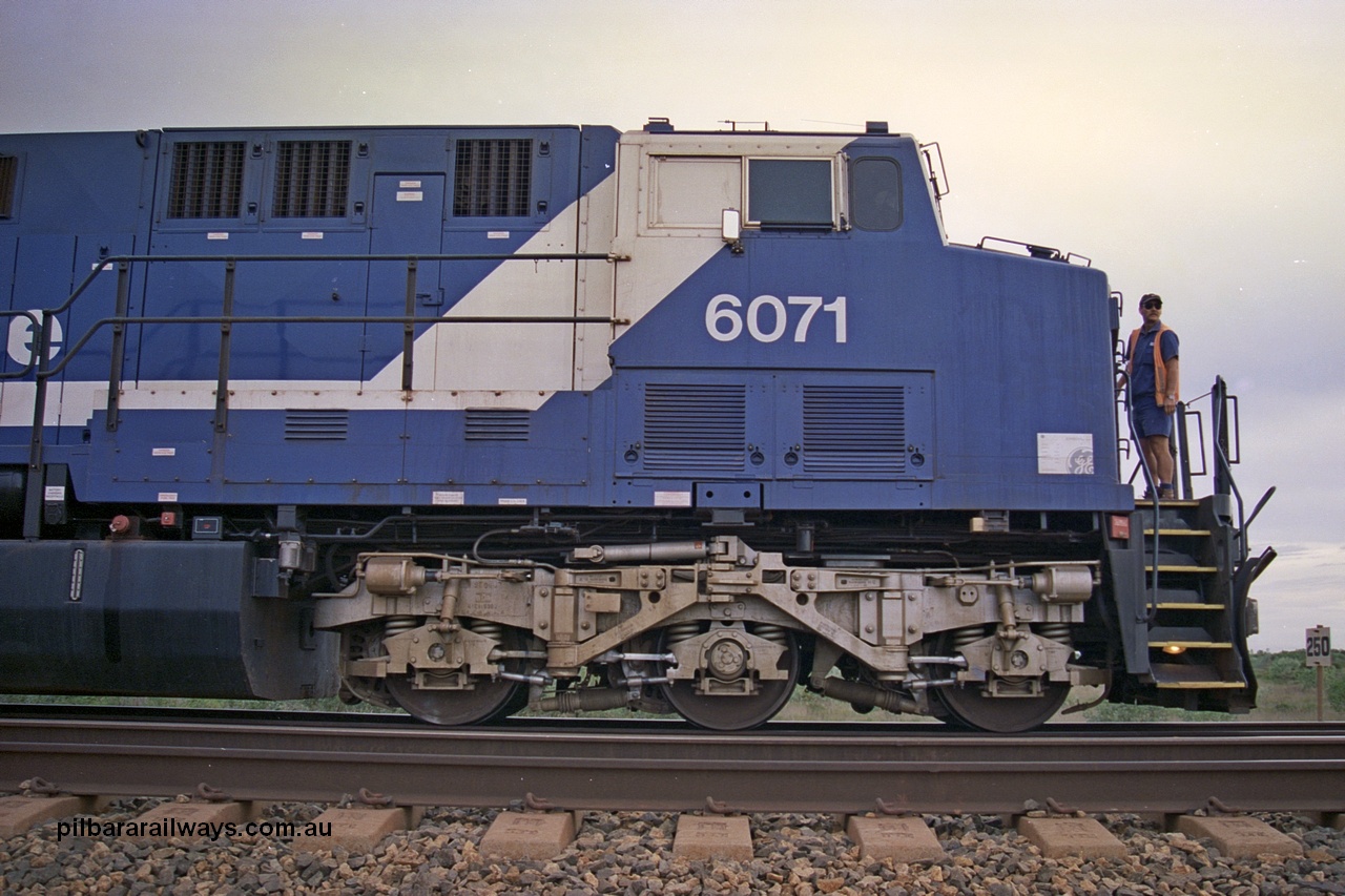 254-23
Bing Siding, cab side view of General Electric AC6000 unit 6071 serial number 51063 with the driver about to enter the cab. The locomotive has not yet been named 'Chichester' in this image. September 2001.
Keywords: 6071;GE;AC6000;51063;