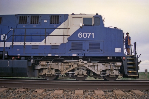 254-23
Bing Siding, cab side view of General Electric AC6000 unit 6071 serial number 51063 with the driver about to enter the cab. The locomotive has not yet been named 'Chichester' in this image. September 2001.
Keywords: 6071;GE;AC6000CW;51063;
