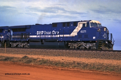 254-25
Bing Siding, an empty train departs behind 6071 an General Electric built AC6000 model with serial number 51063. The locomotive has not yet been named. September 2001.
Keywords: 6071;GE;AC6000CW;51063;