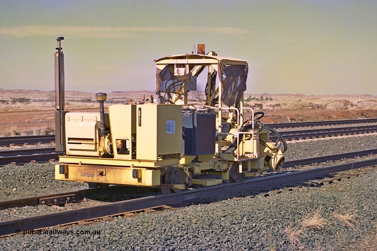 255-03
Siding Three back track, Fairmont Tamper sleeper inserter machine. May 2002.
