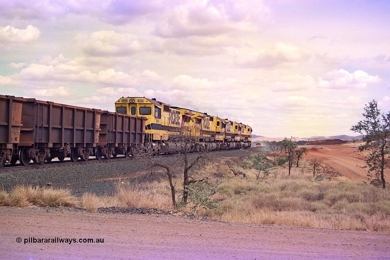 255-32
Western Creek at the 71 km on the Cape Lambert to Deepdale line an empty Robe River train powers upgrade behind the standard quad CM40-8M lash up led by Goninan CM40-8M unit 9425, 9410, 9420 and 9414 with serial number 8206-11 / 91-124. The Western Creek interconnecting line can be seen branching off to the right. Geodata [url=https://goo.gl/maps/fzacjsy5LHGwuSRg8]location here[/url]. May 2002.
Keywords: 9414;Goninan;GE;CM40-8M;8206-11/91-124;rebuild;AE-Goodwin;ALCo;M636;G6060-5;