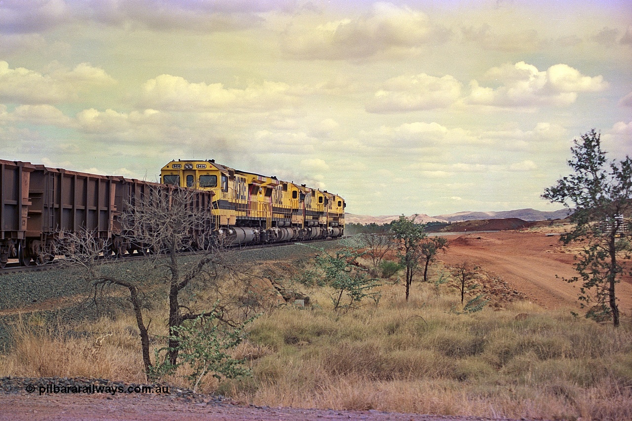 255-33
Western Creek at the 71 km on the Cape Lambert to Deepdale line an empty Robe River train powers upgrade behind the standard quad CM40-8M lash up led by Goninan CM40-8M unit 9425, 9410, 9420 and 9414 with serial number 8206-11 / 91-124. The Western Creek interconnecting line can be seen branching off to the right. Geodata [url=https://goo.gl/maps/fzacjsy5LHGwuSRg8]location here[/url]. May 2002.
Keywords: 9414;Goninan;GE;CM40-8M;8206-11/91-124;rebuild;AE-Goodwin;ALCo;M636;G6060-5;