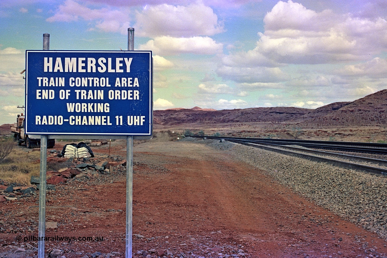 255-35
Emu Siding on the Hamersley Iron Dampier to Tom Price line with the Western Creek Robe River interconnecting line on the left joining the HI Tom Price line. Train Control board for crews to change channels. May 2002.
