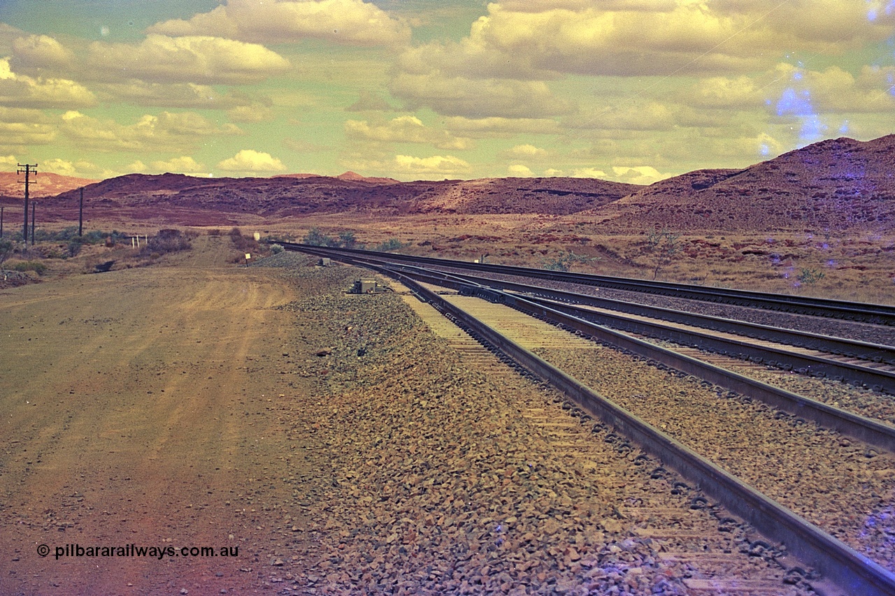 255-37
Emu Siding on the Hamersley Iron Dampier to Tom Price line with the Western Creek Robe River interconnecting line joining the East Mainline, the mileage is 76.3 km on the Robe and 78.4 on the HI. The interconnecting line branches off the Robe River Cape Lambert to Deepdale line at the 71.1 km. Geodata [url=https://goo.gl/maps/EUEYAchcnYTYrAti7]location here[/url]. May 2002.
