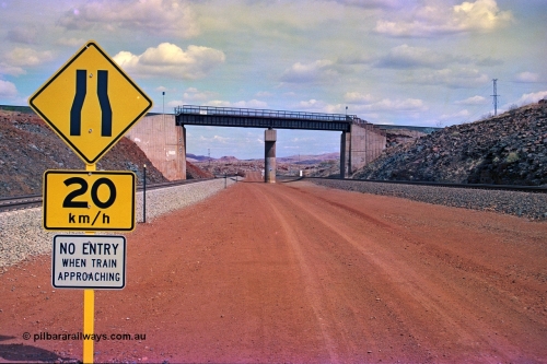 255-21
Western Creek, looking south alongside the Hamersley Iron Dampier to Tom Price line on the right with the new Robe River interconnecting line on the left as both lines pass under the Robe River Cape Lambert to Deepdale line bridge. Geodata [url=https://goo.gl/maps/ajP32PY1Zd11zPRx9]location here[/url]. May 2002.
