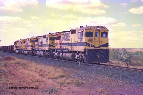 255-28
Western Creek at the 71 km on the Cape Lambert to Deepdale line an empty Robe River train powers upgrade as it heads to Mesa J for loading behind the standard quad CM40-8M lash up led by Goninan CM40-8M unit 9425 with serial number 6266-08 / 89-85 and sisters 9410, 9420 and 9414. Geodata [url=https://goo.gl/maps/fzacjsy5LHGwuSRg8]location here[/url]. May 2002.
Keywords: 9425;Goninan;GE;CM40-8M;6266-8/89-85;rebuild;AE-Goodwin;ALCo;M636;G-6041-4;
