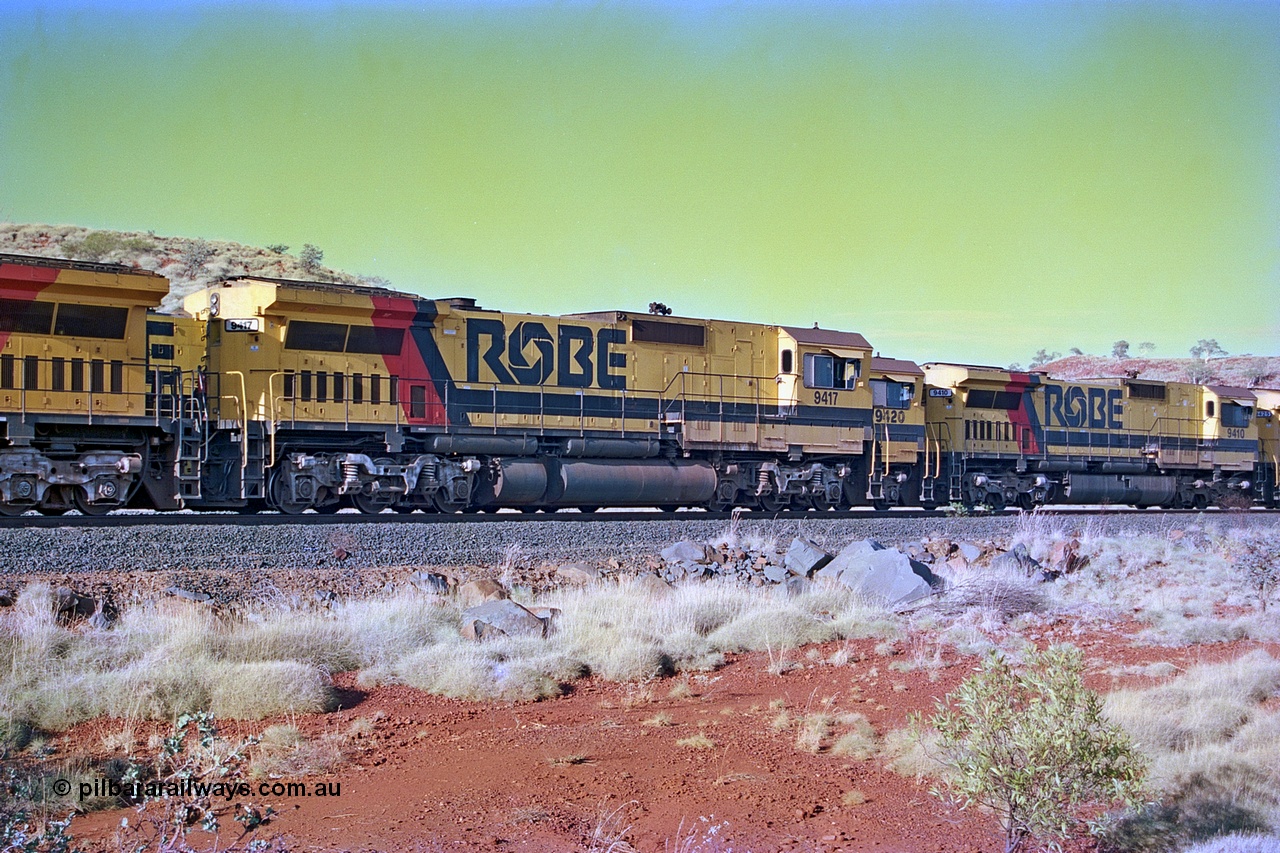 256-24
Maitland Siding, Robe River CM40-8M unit 9417 (2nd) leading an empty train passes sister units 9420 and 9410 on a loaded train. May 2002.
Keywords: 9417;Goninan;GE;CM40-8M;6266-5/89-83;rebuild;ALCo;Schenectady-NY;C636;BN4366;6010-1;