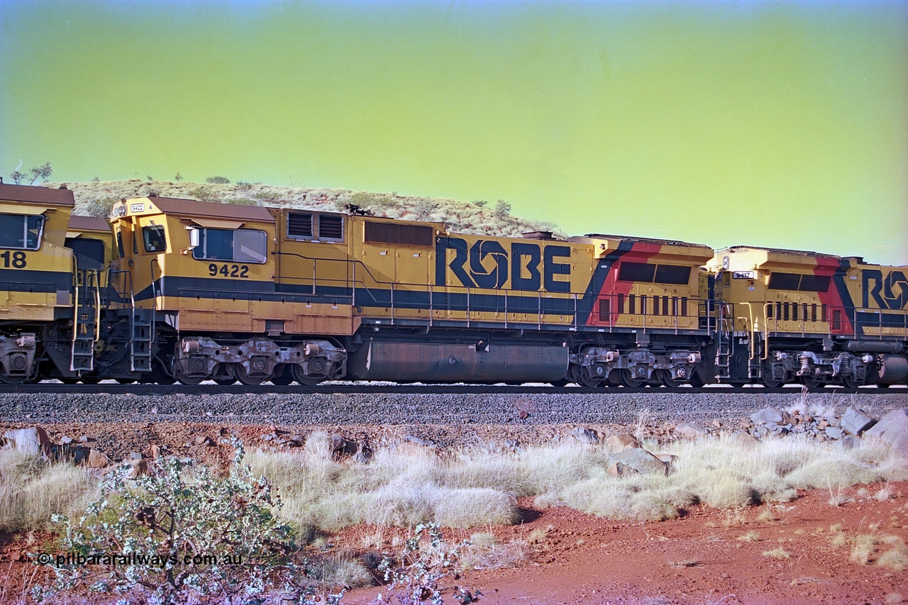 256-25
Maitland Siding, Robe River CM40-8M unit 9422 on an empty train. 9422 was built by Comeng NSW as an ALCo M636 model in August 1977 with serial C6103-2 and delivered to Robe River in November 1977. 22nd February 1979 9422 was lead unit on empty train involved in head on collision at Siding One, it was repaired at Cape Lambert and returned to service. It was eventually rebuilt by Goninan in March 1993 to become an CM40-8M with serial number 8297-03 / 93-138. May 2002.
Keywords: 9422;Goninan;GE;CM40-8M;8297-03/93-138;rebuild;Comeng-NSW;ALCo;M636;C6103-2;