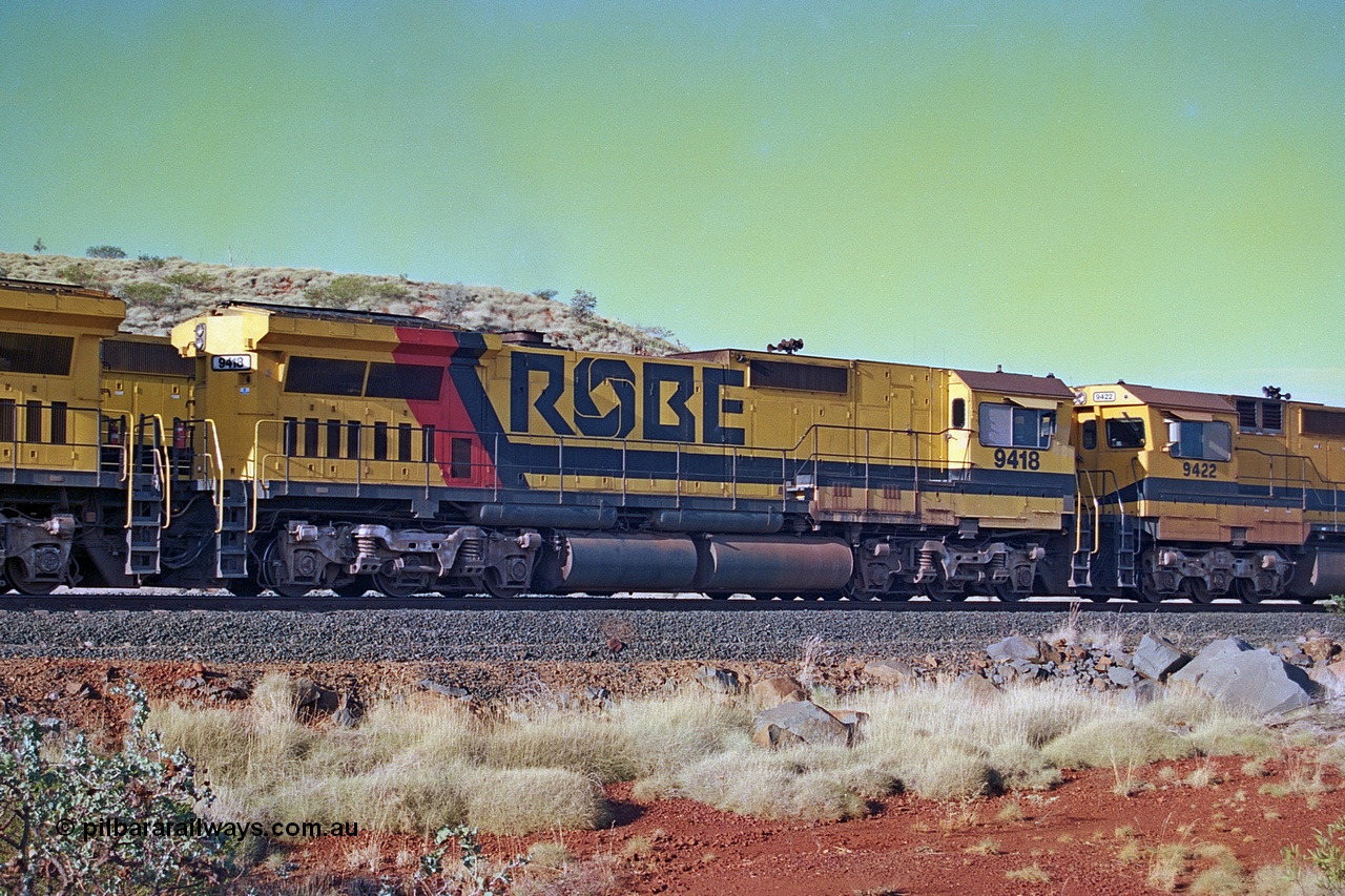 256-26
Maitland Siding, Robe River CM40-8M unit 9418 on an empty train. 9418 was built by ALCo Schenectady NY USA as an ALCo C630 model in October 1967 with serial number 3486-02 for the Chesapeake and Ohio Railroad Company (USA) with road number 2101. It was purchased by Morrison Knudsen for Robe River (along with three sister units) and delivered in January 1975 and repainted and renumbered as 9418 on arrival. 9418 was rebuilt by Goninan WA in December 1990 to become an CM40-8M model with serial number 8109-12 / 90-118. May 2002.
Keywords: 9418;Goninan;GE;CM40-8M;8109-12/90-118;rebuild;ALCo;Schenectady-NY;C630;C+O2101;3486-2;