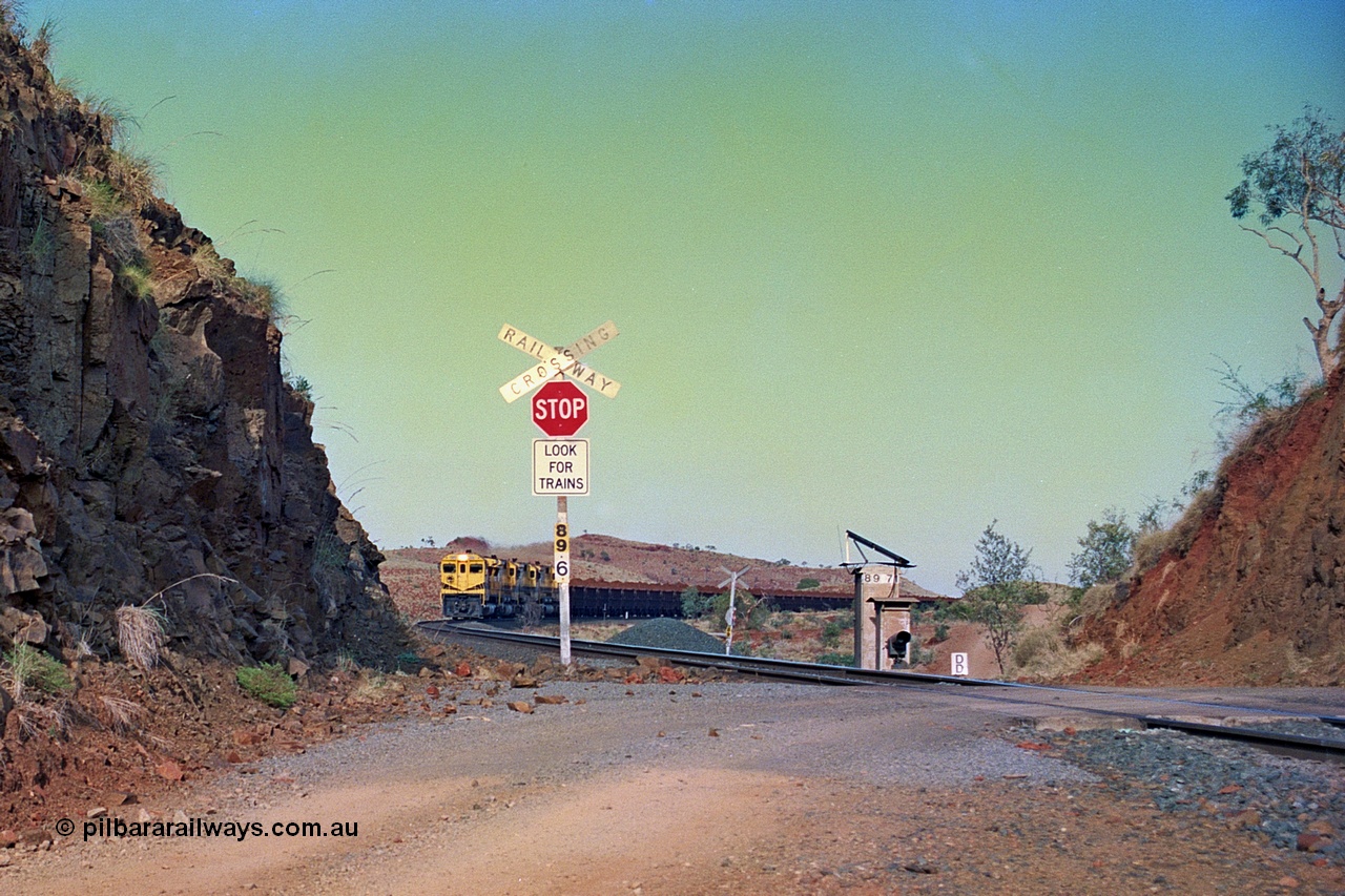 256-29
At the 89.6 km grade crossing and with the meet at Maitland completed the loaded train continues onto Cape Lambert behind the quad CM40-8M working. May 2002.
Keywords: 9414;Goninan;GE;CM40-8M;8206-11/91-124;rebuild;AE-Goodwin;ALCo;M636;G6060-5;