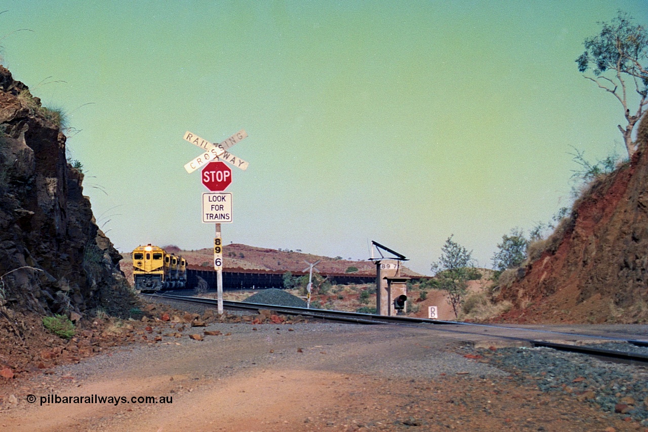 256-30
At the 89.6 km grade crossing and with the meet at Maitland completed the loaded train continues onto Cape Lambert behind the quad CM40-8M working. May 2002.
Keywords: 9414;Goninan;GE;CM40-8M;8206-11/91-124;rebuild;AE-Goodwin;ALCo;M636;G6060-5;