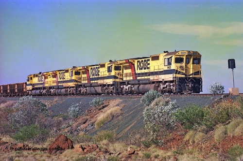 256-02
Maitland Siding on the Cape Lambert to Deepdale railway has a late afternoon empty train with the quad CM40-8M working of 9425, 9410, 9420 and 9414 in the siding waiting for a cross with an opposing loaded train. At the time of this image Siding 3 or Murray Camp was unable to cross ore trains so Siding One - Harding or Siding Two - Maitland were used. May 2002.
Keywords: 9425;Goninan;GE;CM40-8M;6266-8/89-85;rebuild;AE-Goodwin;ALCo;M636;G-6041-4;