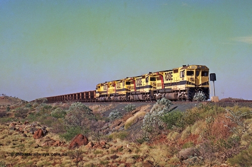 256-04
Maitland Siding on the Cape Lambert to Deepdale railway has a late afternoon empty train with the quad CM40-8M working of 9425, 9410, 9420 and 9414 in the siding waiting for a cross with an opposing loaded train. At the time of this image Siding 3 or Murray Camp was unable to cross ore trains so Siding One - Harding or Siding Two - Maitland were used. May 2002.
Keywords: 9425;Goninan;GE;CM40-8M;6266-8/89-85;rebuild;AE-Goodwin;ALCo;M636;G-6041-4;