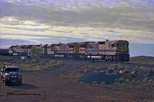256-21
Maitland Siding, morning empty train arriving into the passing track behind quad CM40-8M working of 9417, 9433, 9418 and 9419. May 2002.
Keywords: 9417;Goninan;GE;CM40-8M;6266-5/89-83;rebuild;ALCo;Schenectady-NY;C636;BN4366;6010-1;