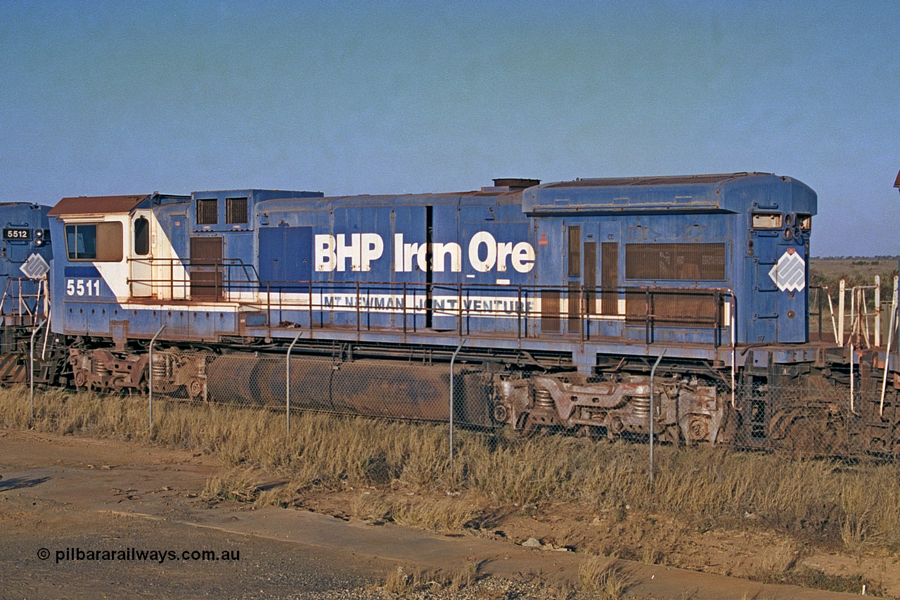 257-02
Flash Butt yard BHP's stored Goninan WA ALCo C636 to GE C36-7M rebuild unit 5511 awaits its fate. Rebuilt in 1987 at Goninan's Welshpool factory from a 1970 AE Goodwin built ALCo C636 with serial number G6035-4 and road number 5463 and assigned new serial number 4839-08 / 87-076. It was delivered in Mount Newman Mining orange and was named Port Hedland. Late 2001.
Keywords: 5511;Goninan;GE;C36-7M;4839-08/87-076;rebuild;AE-Goodwin;ALCo;C636;5463;G6035-4;