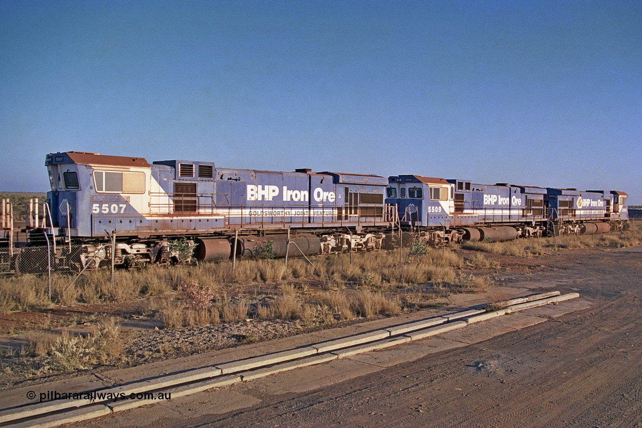 257-03
Flash Butt yard BHP's stored Goninan WA ALCo C636 to GE C36-7M rebuild unit 5507 awaits its fate. Rebuilt in 1987 at Goninan's Welshpool factory from a 1970 AE Goodwin built ALCo C636 with serial number G6035-2 and road number 5461 and assigned new serial number 4839-03 / 87-072. It was delivered in Mount Newman Mining orange and was named Port Hedland. Late 2001.
Keywords: 5507;Goninan;GE;C36-7M;4839-03/87-072;rebuild;AE-Goodwin;ALCo;C636;5461;G6035-2;