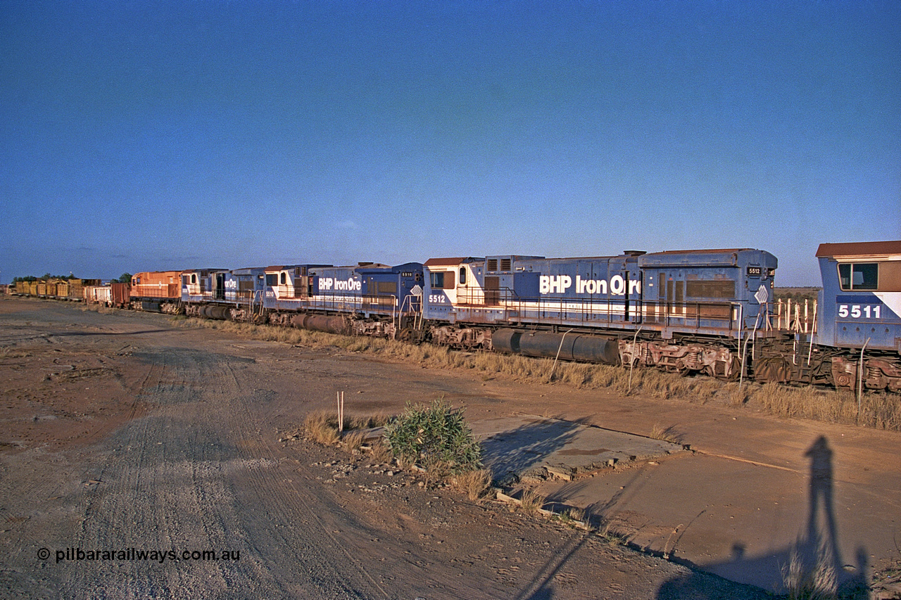 257-04
Flash Butt yard BHP's stored Goninan WA ALCo C636 to GE C36-7M rebuild unit 5512 awaits its fate. Rebuilt in 1988 at Goninan's Welshpool factory from a 1970 AE Goodwin built ALCo C636 with serial number G6041-1 and road number 5455 and assigned new serial number 4839-01 / 88-077. It was delivered in Mount Newman Mining orange and was named Hesta. Late 2001.
Keywords: 5512;Goninan;GE;C36-7M;4839-01/88-077;rebuild'AE-Goodwin;ALCo;C636;5465;G6041-1;