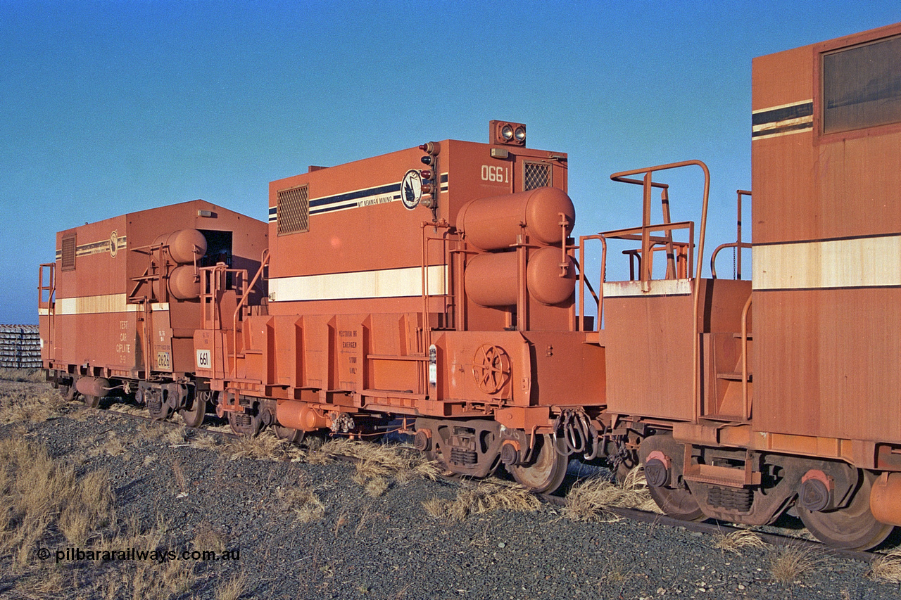 257-13
Flash Butt yard, Locotrol II remote waggon 661 which is modified from a Magor USA ore waggon in the late 1980s with Locotrol I remote waggon 2626 modified from a Comeng ore waggon in the 1980s. Late 2001.
