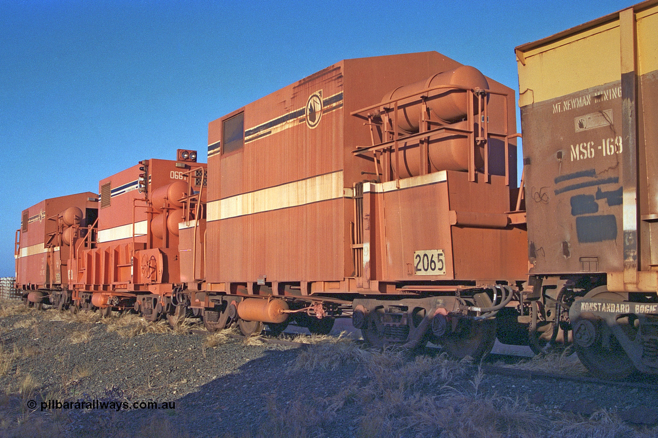 257-14
Flash Butt yard, Locotrol I remote waggon 2065 which is modified from a Comeng ore waggon in the 1980s, Locotrol II remote waggon 661 modified from a Magor USA ore waggon in the late 1980s and Locotrol I remote waggon 2626 modified Comeng ore waggon in the 1980s. Late 2001.
