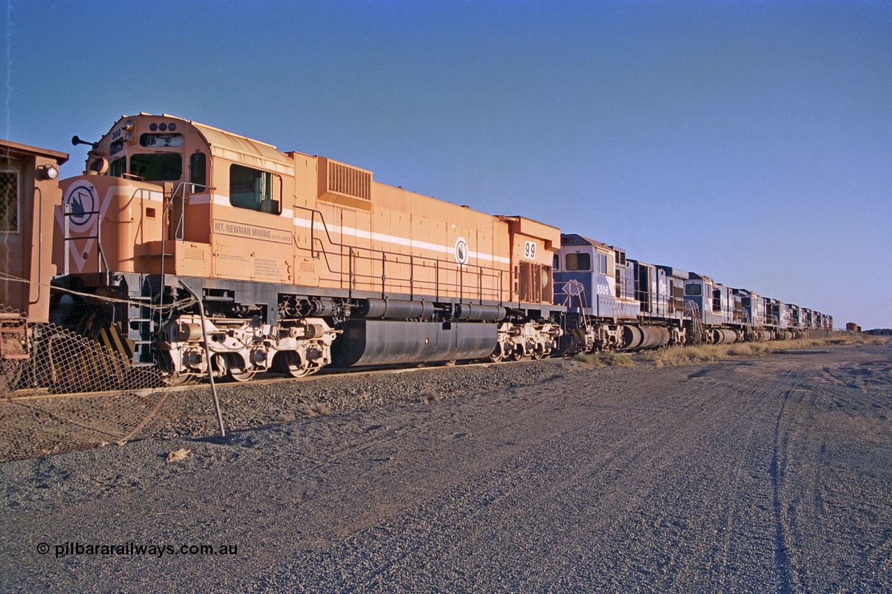 257-16
Flash Butt yard, line up of retired power, the final Comeng NSW built ALCo M636 unit 5499 serial number C6096-4 in Mount Newman Mining livery and then the eight withdrawn Goninan ALCo to GE rebuild C36-7M units 5506, 5510, 5512, 5511, 5513, 5507, 5509 and 5508. Late 2001.
Keywords: 5499;Comeng-NSW;ALCo;M636;C6096-4;