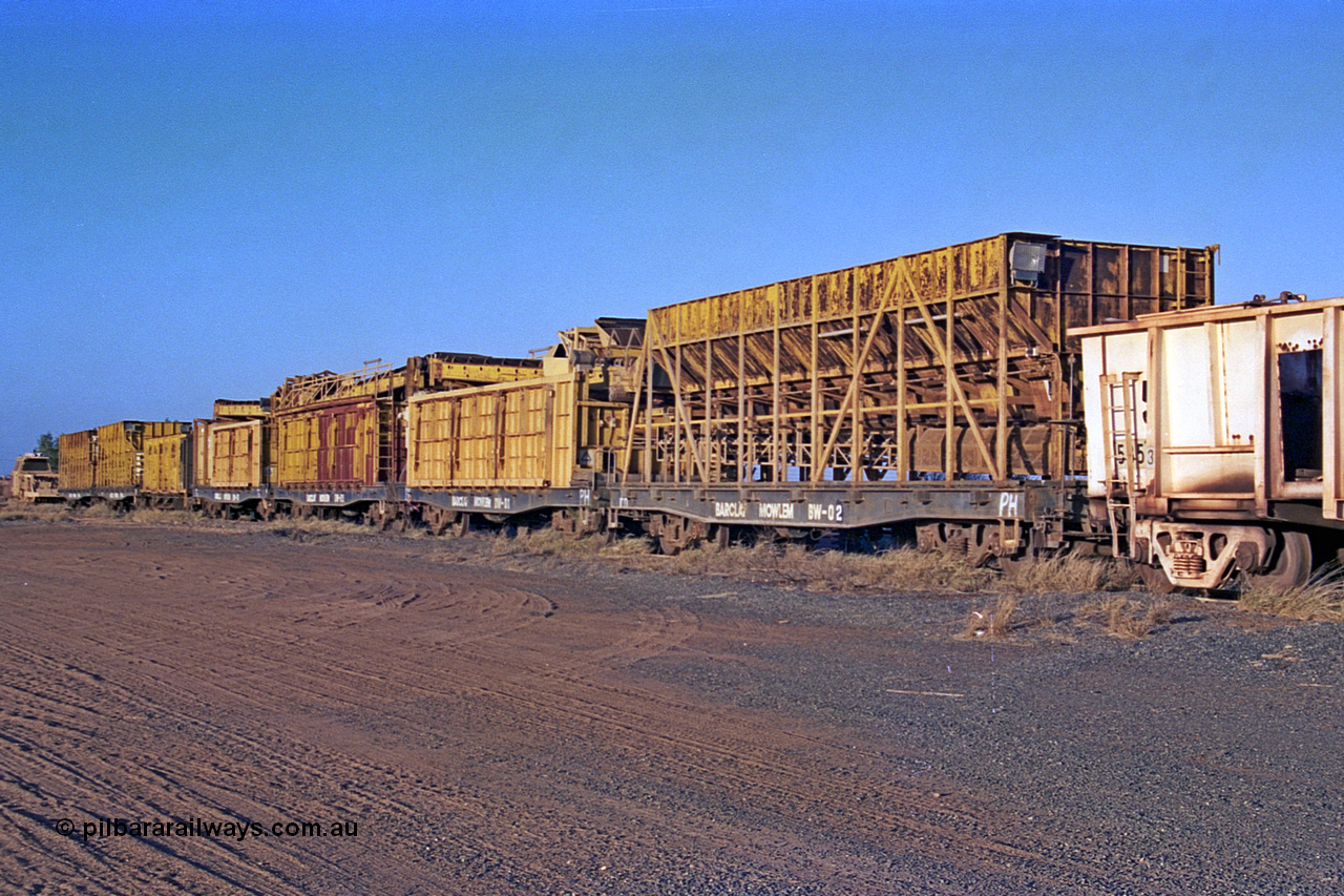 257-22
Flash Butt yard, the Barclay Mowlem ballast cleaning train known as the Circus Train, waggons BW-02 and DW-01 closest to camera. Late 2001.
