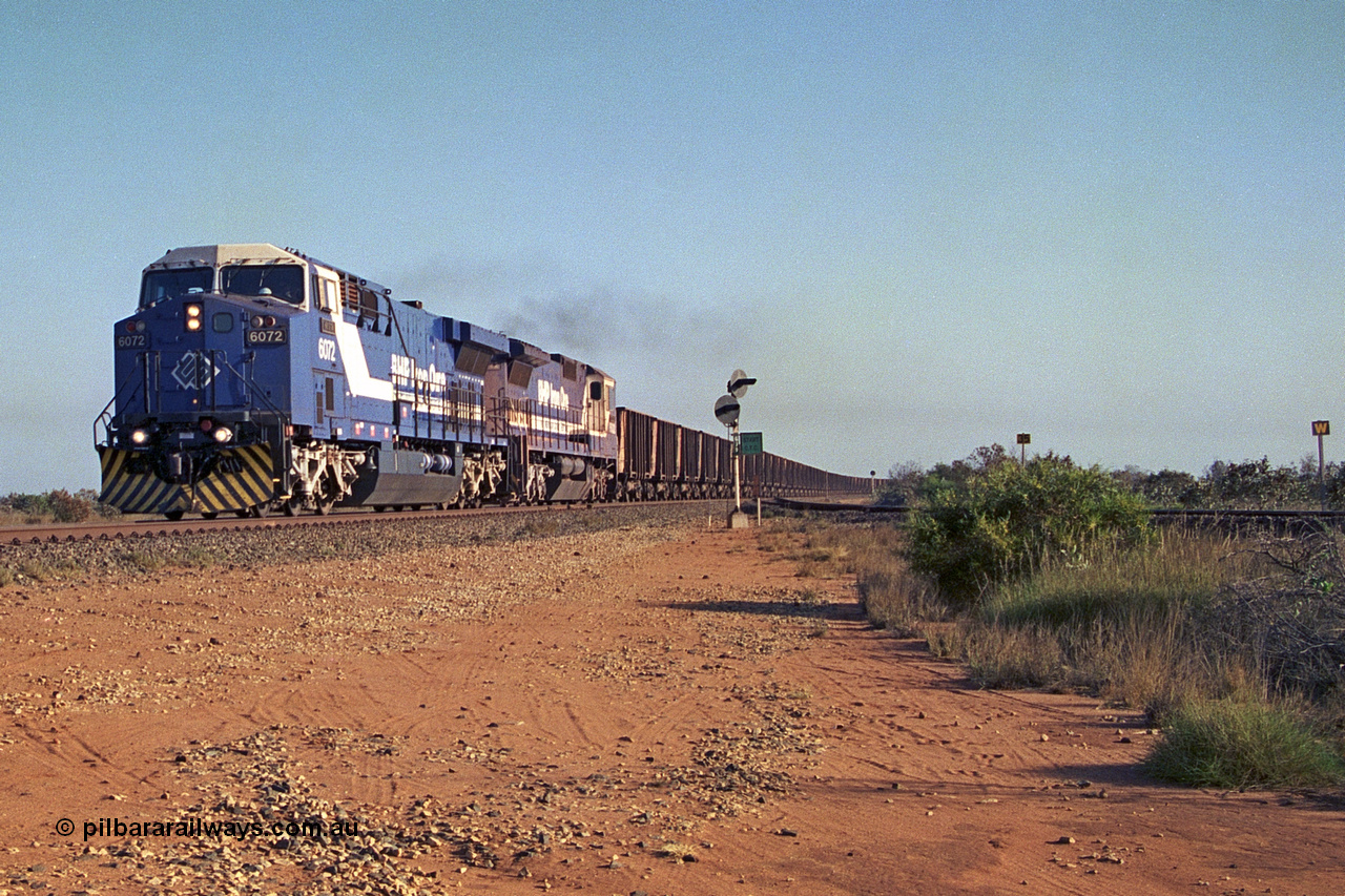 257-31
Goldsworthy Junction an empty train thunders through the junction behind 6000 horsepower behemoth 6072 'Hesta' serial number 51064 and built by General Electric in Erie USA in 1999 and a new built CM39-8 unit 5632 'Poseidon' by Goninan with serial number 5831-11 / 88-081. Late 2001.
Keywords: 6072;GE;AC6000;51064;