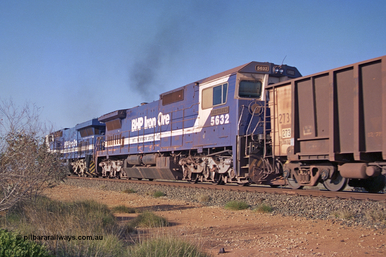 257-32
Goldsworthy Junction, empty train with second unit BHP Iron Ore loco 5632 'Poseidon' one of four new built GE CM39-8 model locomotives by Goninan in late 1998 with serial number 5831-11 / 88-081.
Keywords: 5632;Goninan;GE;CM39-8;5831-11/88-081;