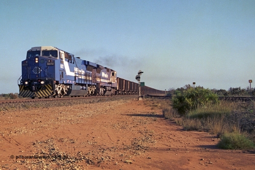 257-31
Goldsworthy Junction an empty train thunders through the junction behind 6000 horsepower behemoth 6072 'Hesta' serial number 51064 and built by General Electric in Erie USA in 1999 and a new built CM39-8 unit 5632 'Poseidon' by Goninan with serial number 5831-11 / 88-081. Late 2001.
Keywords: 6072;GE;AC6000CW;51064;