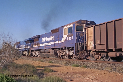 257-32
Goldsworthy Junction, empty train with second unit BHP Iron Ore loco 5632 'Poseidon' one of four new built GE CM39-8 model locomotives by Goninan in late 1998 with serial number 5831-11 / 88-081.
Keywords: 5632;Goninan;GE;CM39-8;5831-11/88-081;