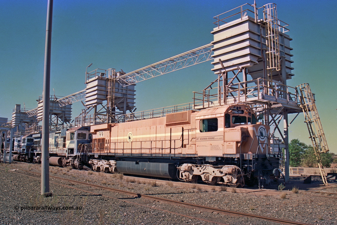 258-24
Nelson Point, old Loco Prep, Mt Newman Mining's last in-service ALCo M636 unit 5499 serial C6096-4 built by Comeng NSW sits awaiting partial dismantling before being sent by road to Rail Heritage WA's museum at Bassendean, Perth for preservation. Behind it are C36-7M units 5506 and 5510, both of which went to Asset Kinetics. May 2002.
Keywords: 5499;Comeng-NSW;MLW-ALCo;M636;C6096-4;