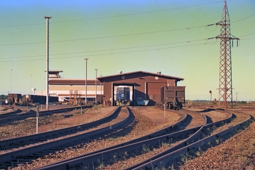 258-32
Nelson Point, Wheel Lathe shop with Ore Car Repair Shop and Yard Control behind it. General Electric built AC6000 locomotive 6074 'Kalgan' is out the front. Early May 2002.
Keywords: 6074;GE;AC6000CW;51066;