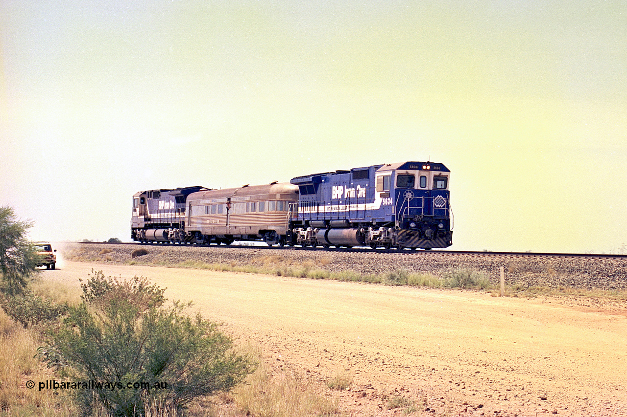 267-26
On approach to the 39 km Detector Site the Sundowner Special runs along the Newman Mainline behind BHP Iron Ore's Goninan rebuild CM40-8M unit 5634 'Boodarie' serial number 8151-07 / 91-120 with sister 5653 on the rear. Friday 12th of April 2002.
Keywords: 5634;Goninan;GE;CM40-8M;8151-07/91-120;rebuild;AE-Goodwin;ALCo;C636;5457;G6027-1;
