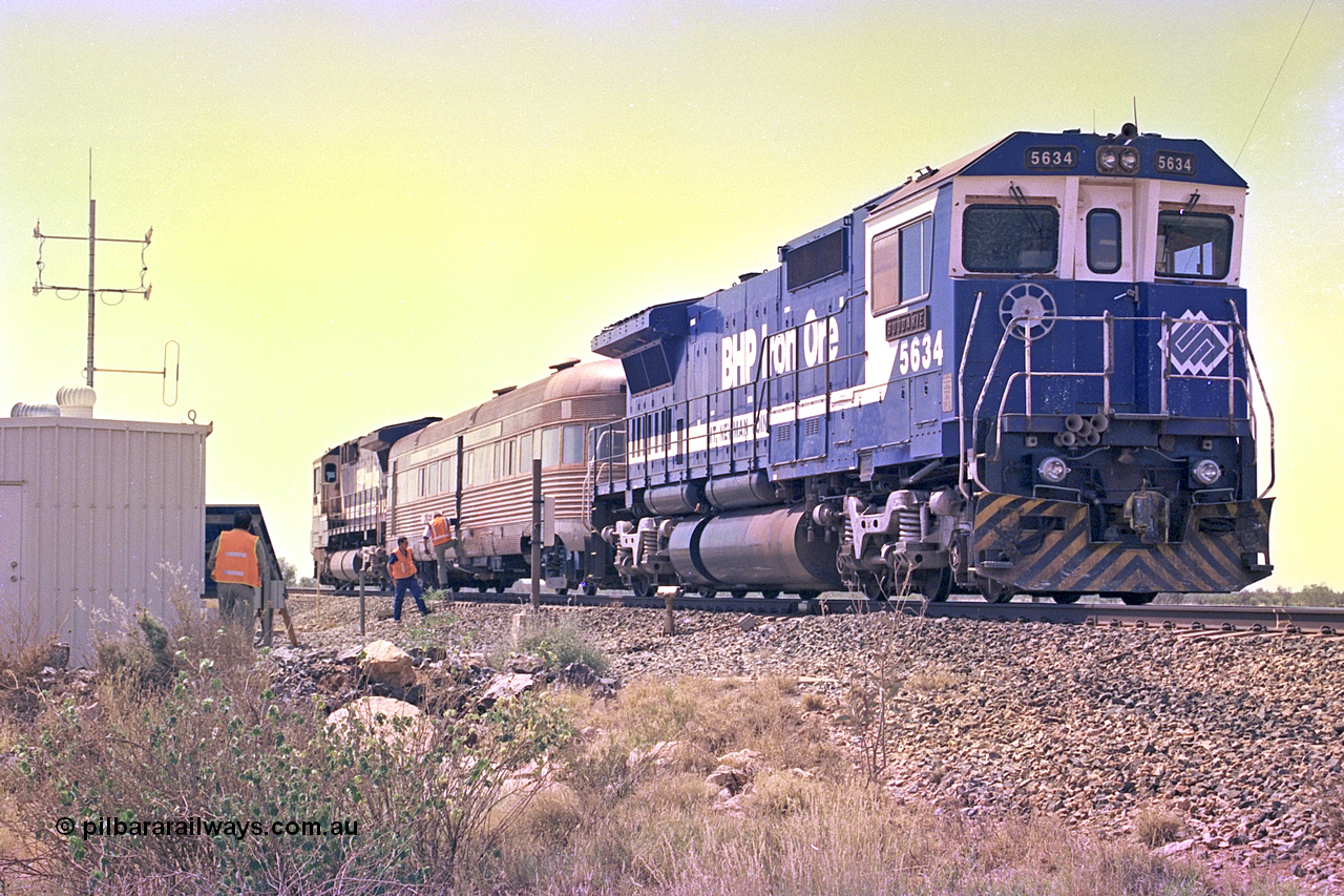 267-35
At the 39 km detection site with the Alstom 25-year service agreement special, BHP Iron Ore's Goninan GE rebuild CM40-8M unit 5634 'Boodarie' serial number 8151-07 / 91-120 stands on the Newman mainline with the train as the party alight for an inspection of the site. Friday 12th of April 2002.
Keywords: 5634;Goninan;GE;CM40-8M;8151-07/91-120;rebuild;AE-Goodwin;ALCo;C636;5457;G6027-1;