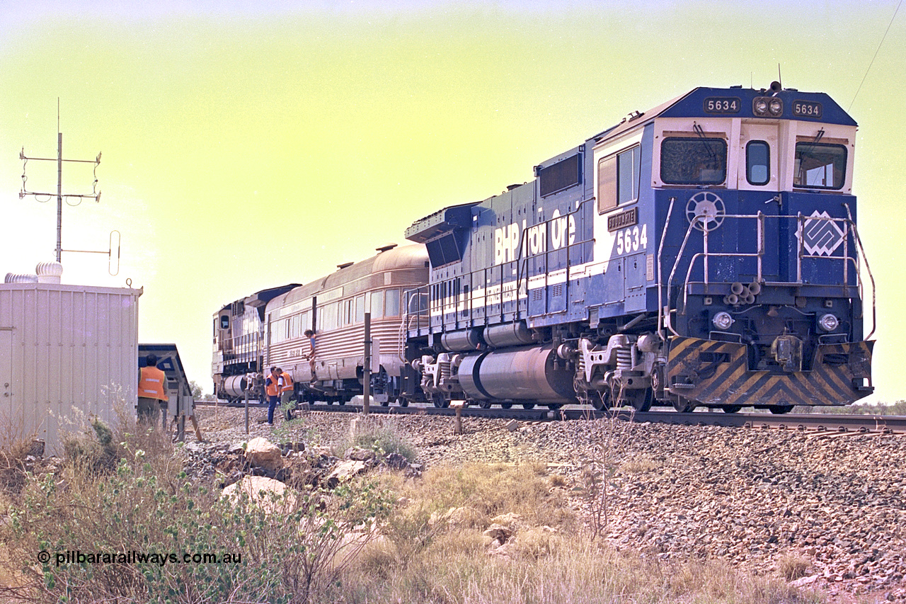 267-36
At the 39 km detection site with the Alstom 25-year service agreement special, BHP Iron Ore's Goninan GE rebuild CM40-8M unit 5634 'Boodarie' serial number 8151-07 / 91-120 stands on the Newman mainline with the train as the party alight for an inspection of the site.
Friday 12th of April 2002.
Keywords: 5634;Goninan;GE;CM40-8M;8151-07/91-120;rebuild;AE-Goodwin;ALCo;C636;5457;G6027-1;