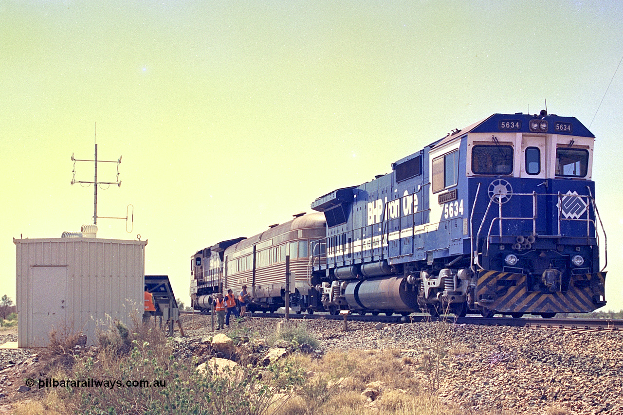 267-37
At the 39 km detection site with the Alstom 25-year service agreement special, BHP Iron Ore's Goninan GE rebuild CM40-8M unit 5634 'Boodarie' serial number 8151-07 / 91-120 stands on the Newman mainline with the train as the party alight for an inspection of the site.
Friday 12th of April 2002.
Keywords: 5634;Goninan;GE;CM40-8M;8151-07/91-120;rebuild;AE-Goodwin;ALCo;C636;5457;G6027-1;