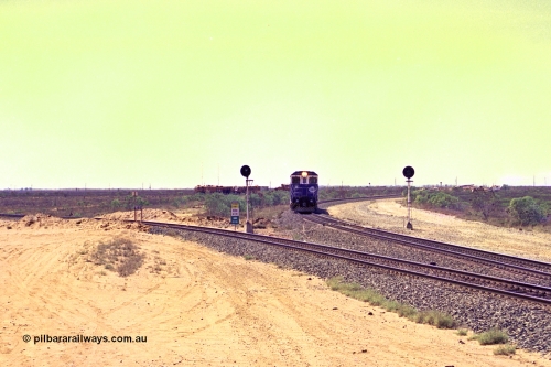 267-16
Goldsworthy Junction, the Sundowner Special is on the Newman mainline leg of the Goldsworthy Junction and triangle, with the Sundowner coach in between CM40-8M GE unit 5634 'Boodarie' serial number 8151-07 / 91-120 and sister CM40-8M 5653. This train, and the empty before it, were delayed due to a jamming switch for the transfer road where Tamper 2 and Ballast Regulator 31 can be seen holding track. The road curving around to the left is the Goldsworthy mainline to Boodarie and Finucane Island. Friday April 12, 2002.
Keywords: 5634;Goninan;GE;CM40-8M;8151-07/91-120;rebuild;AE-Goodwin;ALCo;C636;5457;G6027-1;