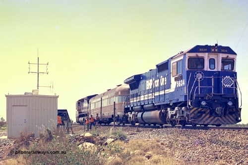 267-37
At the 39 km detection site with the Alstom 25-year service agreement special, BHP Iron Ore's Goninan GE rebuild CM40-8M unit 5634 'Boodarie' serial number 8151-07 / 91-120 stands on the Newman mainline with the train as the party alight for an inspection of the site.Friday April 12, 2002.
Keywords: 5634;Goninan;GE;CM40-8M;8151-07/91-120;rebuild;AE-Goodwin;ALCo;C636;5457;G6027-1;