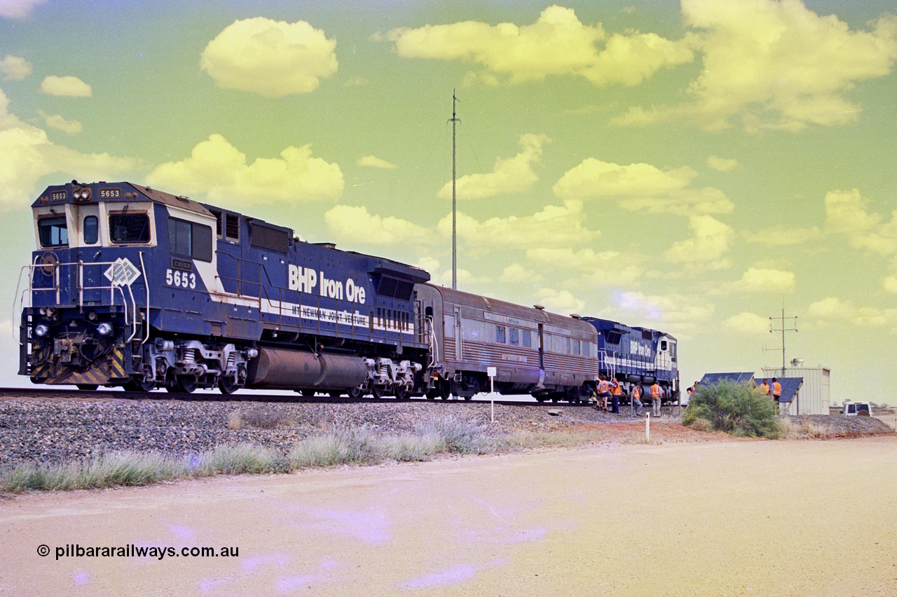 268-01
At the 39 km detection site with the Alstom 25-year service agreement special, BHP Iron Ore's Goninan GE rebuild CM40-8M unit 5653 'Chiba' serial number 8412-10 / 93-144 stands on the Newman mainline with The Sundowner and 5634 on the rear of the train as the party conducts an inspection of the site. Friday 12th of April 2002.
Keywords: 5653;Goninan;GE;CM40-8M;8412-10/93-144;rebuild;AE-Goodwin;ALCo;M636C;5484;G6061-5;