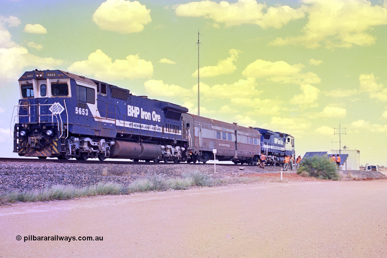 268-02
At the 39 km detection site with the Alstom 25-year service agreement special, BHP Iron Ore's Goninan GE rebuild CM40-8M unit 5653 'Chiba' serial number 8412-10 / 93-144 stands on the Newman mainline with The Sundowner and 5634 on the rear of the train as the party conducts an inspection of the site. Friday 12th of April 2002.
Keywords: 5653;Goninan;GE;CM40-8M;8412-10/93-144;rebuild;AE-Goodwin;ALCo;M636C;5484;G6061-5;