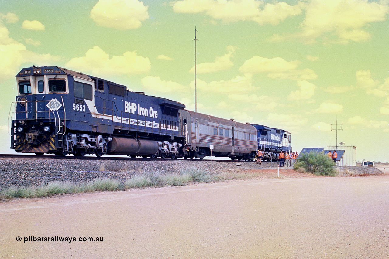 268-03
At the 39 km detection site with the Alstom 25-year service agreement special, BHP Iron Ore's Goninan GE rebuild CM40-8M unit 5653 'Chiba' serial number 8412-10 / 93-144 stands on the Newman mainline with The Sundowner and 5634 on the rear of the train as the party conducts an inspection of the site. Friday 12th of April 2002.
Keywords: 5653;Goninan;GE;CM40-8M;8412-10/93-144;rebuild;AE-Goodwin;ALCo;M636C;5484;G6061-5;