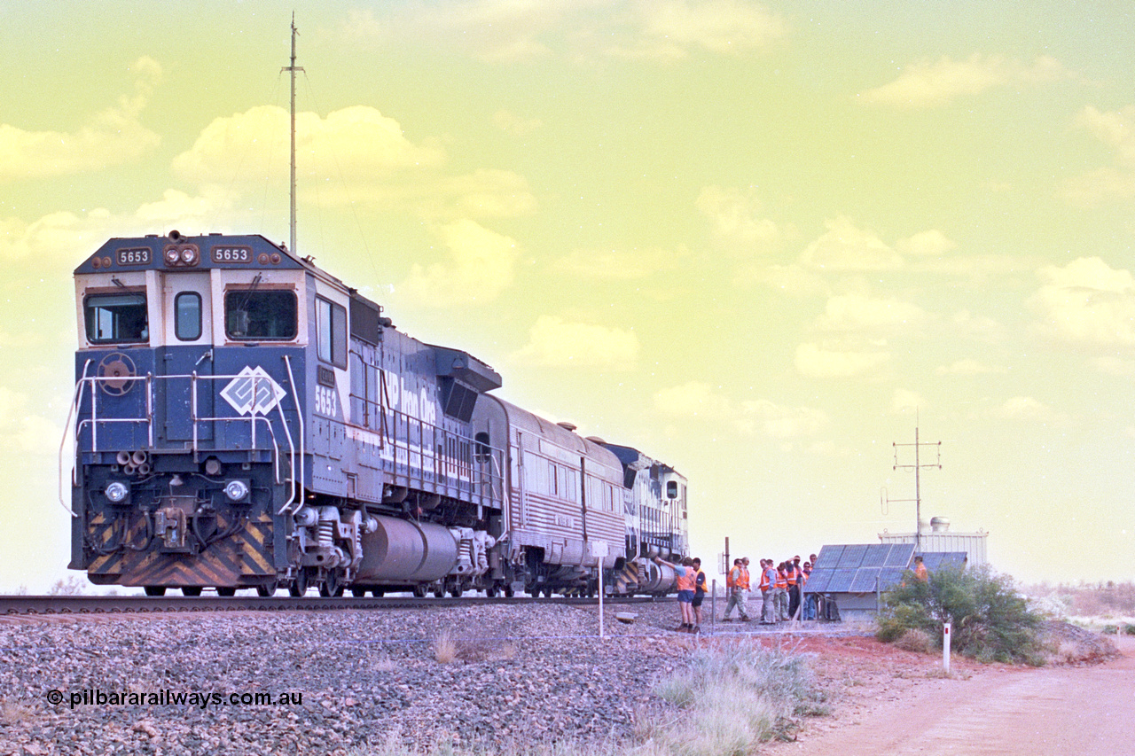 268-05
At the 39 km detection site with the Alstom 25-year service agreement special, BHP Iron Ore's Goninan GE rebuild CM40-8M unit 5653 'Chiba' serial number 8412-10 / 93-144 stands on the Newman mainline with The Sundowner and 5634 on the rear of the train as the party conducts an inspection of the site. Friday 12th of April 2002.
Keywords: 5653;Goninan;GE;CM40-8M;8412-10/93-144;rebuild;AE-Goodwin;ALCo;M636C;5484;G6061-5;