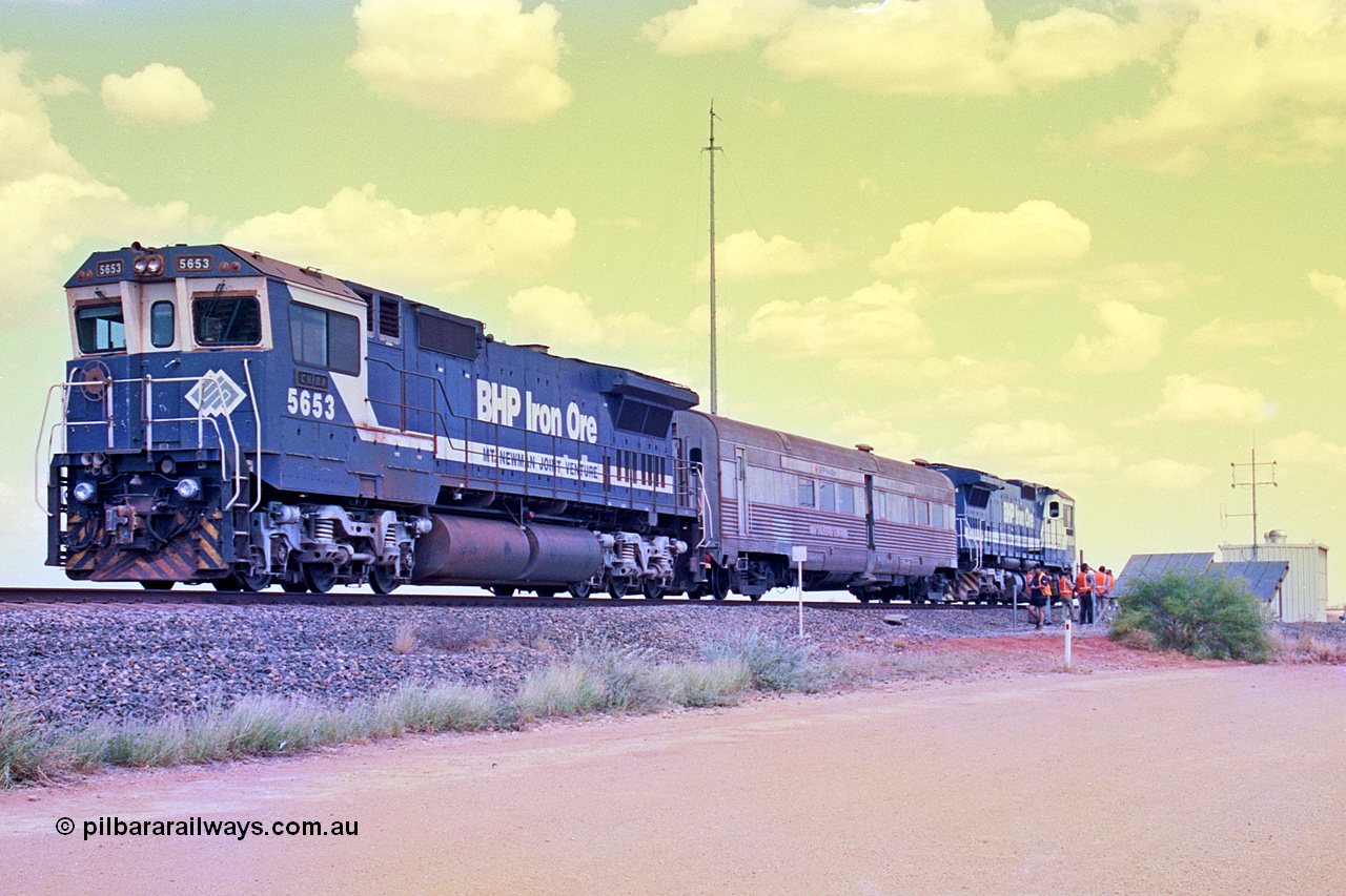 268-06
At the 39 km detection site with the Alstom 25-year service agreement special, BHP Iron Ore's Goninan GE rebuild CM40-8M unit 5653 'Chiba' serial number 8412-10 / 93-144 stands on the Newman mainline with The Sundowner and 5634 on the rear of the train as the party conducts an inspection of the site. Friday 12th of April 2002.
Keywords: 5653;Goninan;GE;CM40-8M;8412-10/93-144;rebuild;AE-Goodwin;ALCo;M636C;5484;G6061-5;