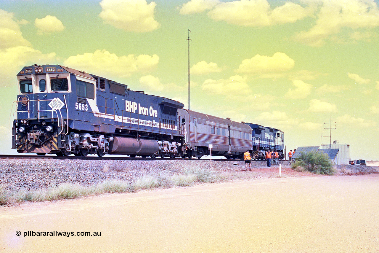 268-07
At the 39 km detection site with the Alstom 25-year service agreement special, BHP Iron Ore's Goninan GE rebuild CM40-8M unit 5653 'Chiba' serial number 8412-10 / 93-144 stands on the Newman mainline with The Sundowner and 5634 on the rear of the train as the party conducts an inspection of the site. Friday 12th of April 2002.
Keywords: 5653;Goninan;GE;CM40-8M;8412-10/93-144;rebuild;AE-Goodwin;ALCo;M636C;5484;G6061-5;